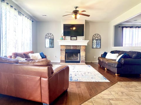 Large living room with two extra large sofas and a loveseat