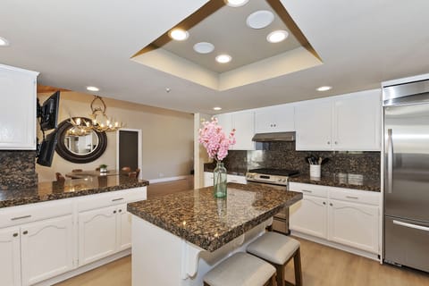 Island with 3 bar stools.