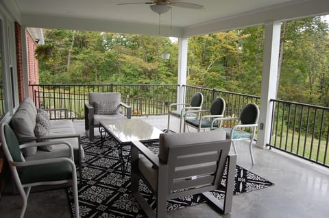 Covered back porch.  Great for gathering and relaxing any time of the day.