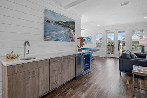 2nd floor wet bar w/ icemaker and wine fridge, pool table, lounge area