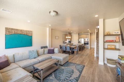 Downstairs Living Room - The Living Room is conveniently located adjacent to the Kitchen and Dining Table and is a great place for entertaining guests during downtime.