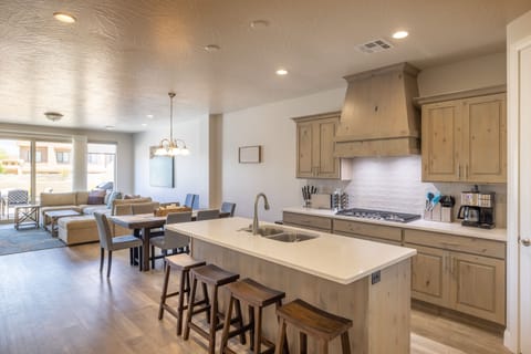 Kitchen View - The Kitchen Island comfortably seats 4 adults and creates a great space for serving and preparing meals.