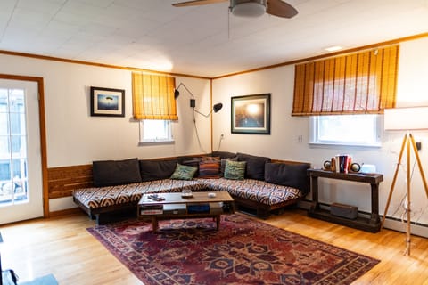 Living room with corner couch and art  