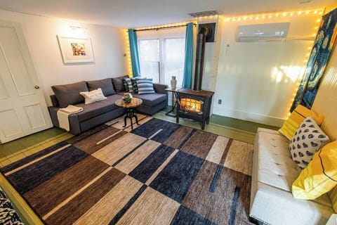 1st floor living room. Sitting around the fireplace.