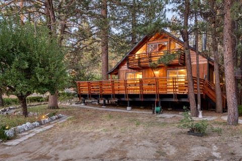 Gorgeous cabin with a large deck and an upper balcony.