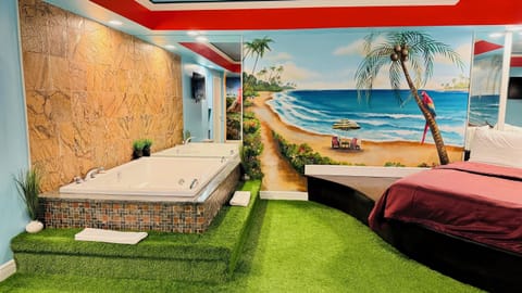 Hawaiian Paradise Romantic Suite with Hot Tub and Fireplace | Premium bedding, down comforters, memory foam beds