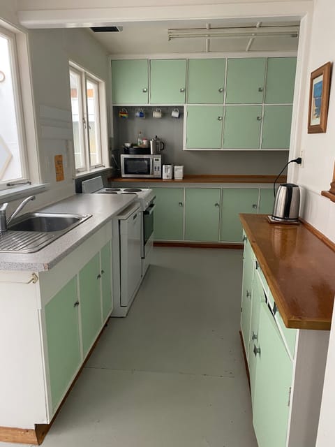 Retro kitchen with dishwasher, microwave and large french door fridge freezer