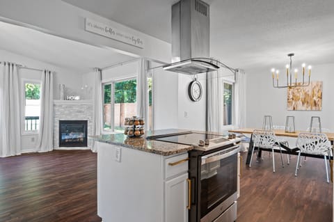 Kitchen is located between 2 living rooms - large open space.