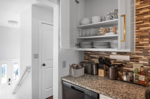 Plates, cups, cookware, small appliances, spices, cooking oil, etc. Full kitchen