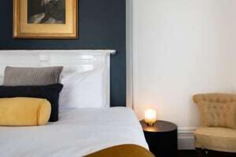 Elegant king bed in the master suite