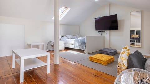 This cozy living room has a retractable bed built into the wall. Come with friends or family, to have a memorable vacation #cozy #memorable #portugal #pt #lisbon
