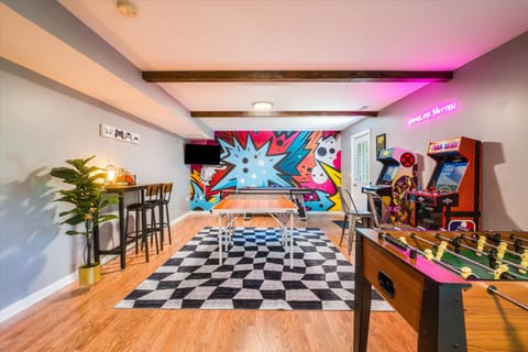 Game room with foosball table, air hockey, 42" TV, arcade games, ping pong table