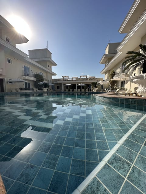 Outdoor pool, open 8:00 AM to 8:00 PM, sun loungers