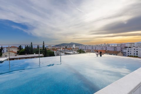 Seasonal outdoor pool, pool umbrellas, sun loungers