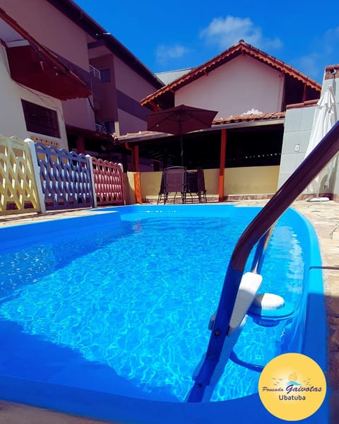 Outdoor pool, open 10:00 AM to 10:00 PM, pool umbrellas, sun loungers