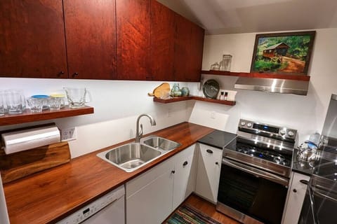 Wood Counters are throughout the building — they’re oiled & waxed, repelling water & grease well. Spots may appear from acidic lemons, vinegar. Try not to — but relax, a little spotting happens. Use the chopping blocks, trivets & pot holder/pads.