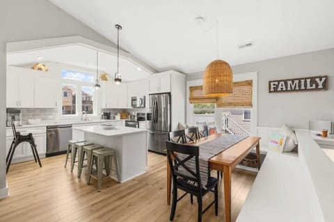 Bright, open-concept main living area featuring an updated kitchen and a seamlessly connected dining space - ideal for entertaining!