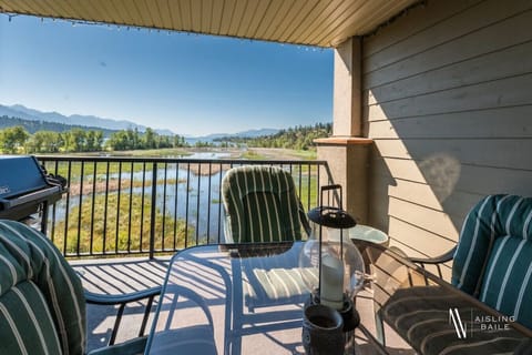 Private third-floor balcony outdoor seating, a BBQ and incredible lake views.