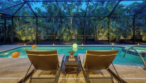 Your private resort after dark—settle in poolside while the palms light up around you, creating the kind of tropical evening you don't want to end.