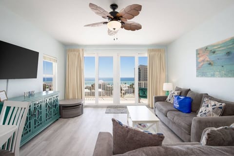 Ocean View Living Area with Flat Screen TV, Sleeper Sofa and Private Balcony Access