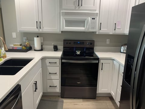 Full kitchen with everything you need- keurig/coffee combo dishes crockpot pans