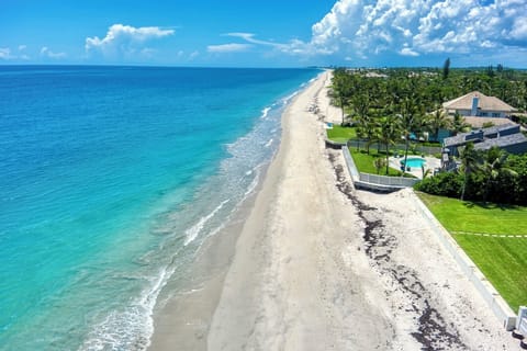Private, white sand beach facing south