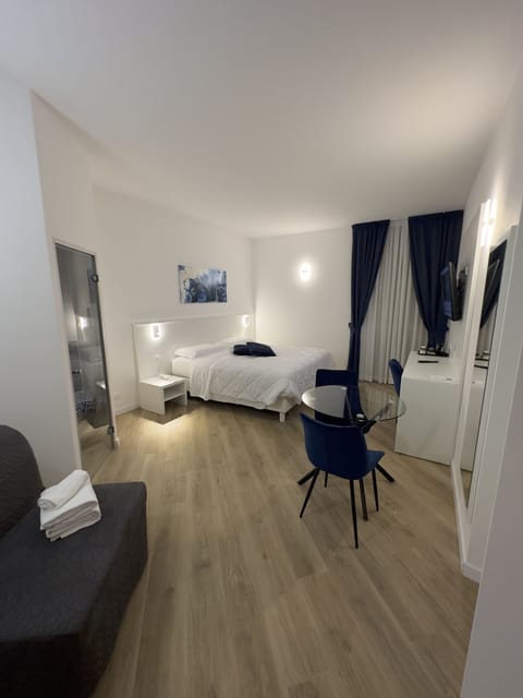 Premium bedding, down comforters, free minibar items, in-room safe
