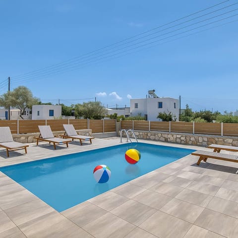 Swimming Pool with Loungers
View of the pool with ample loungers and clear blue skies above.