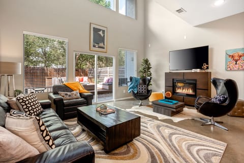 Step into a stylish, cozy living room with modern decor, plush seating, and a welcoming ambiance—the perfect space to unwind after a day at Dickies Arena.