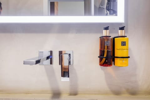 Shower, rainfall showerhead, hair dryer, towels