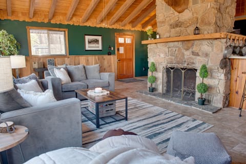 Living room with masonry fireplace.