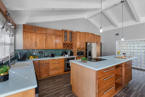 Beautiful wooden cabinetry and sleek finishes bring together classic warmth and modern functionality.