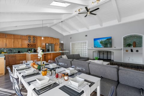 This spacious dining area connects seamlessly to the kitchen and outdoor pool — perfect for entertaining.