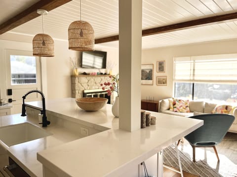 Easy mingling between kitchen and living room.