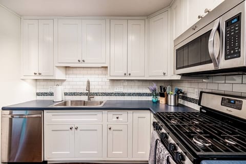 Kitchen with large island, drip coffeemaker, and Keurig