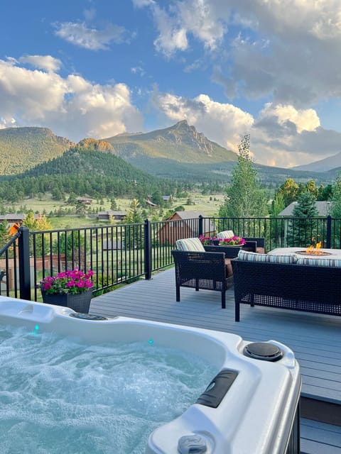 Back deck with amazing views, seating, gas fire pit table, hot tub and grill
