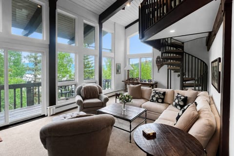 This top floor unit has open beam ceiling in the living room and large outdoor patio overlooking Snowmass Mountain