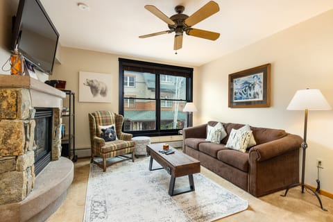 Cozy up in this inviting living room where rustic charm meets modern comfort—your perfect mountain retreat awaits.