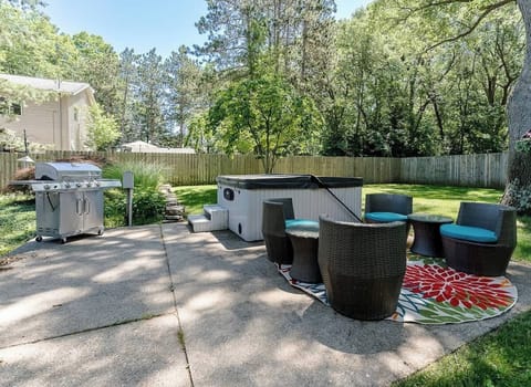 Hot Tub & Sitting area in backyard