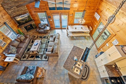 A view of the main level of the cabin from the upstairs landing.