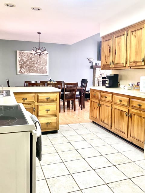 Stocked  kitchen with counter top ice maker, and Keurig and drip coffee makers