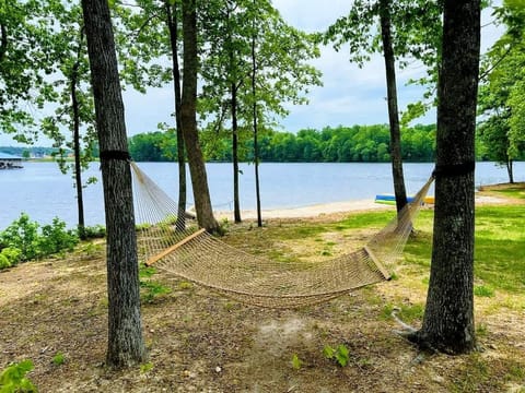 Unwind in paradise! Relax in the hammock with breathtaking lake views, just steps from your 120-foot private beach. Feel the breeze, listen to the water, and enjoy pure serenity. The perfect spot to recharge and soak in nature! ✨