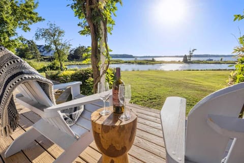 Start your stay at the waterfront Sunset Serenity with a glass of wine.
