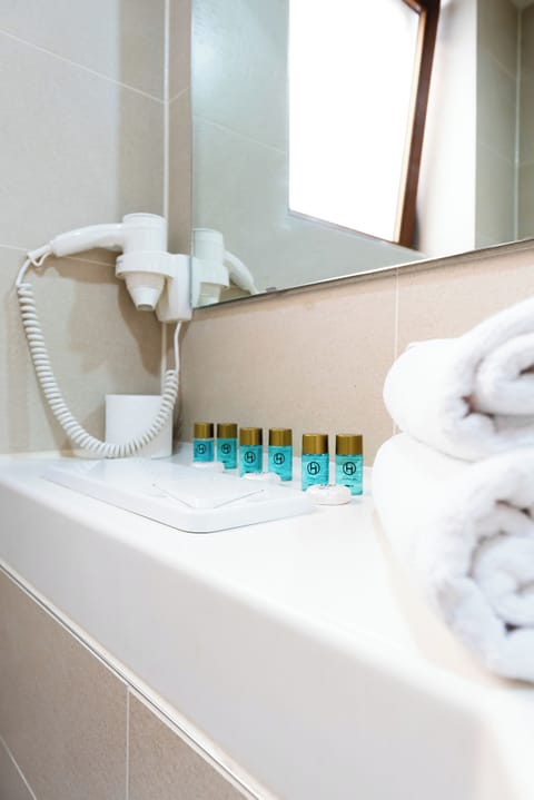 Shower, rainfall showerhead, hair dryer, towels