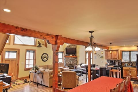 3 couches & ottoman, 1 chair w/ ottoman, recliner, & a large slate coffee table