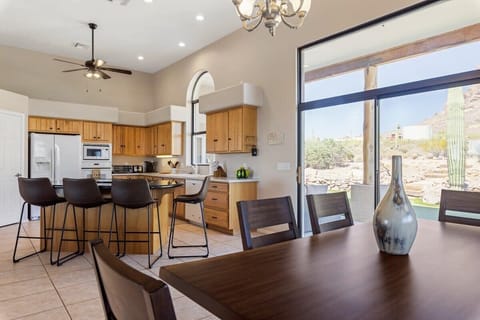 dining room looking into the kitchen and backyard