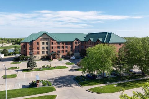 Aerial view of building with green roof.