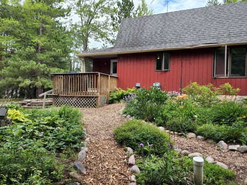 Peaceful perennial gardens surround one side.