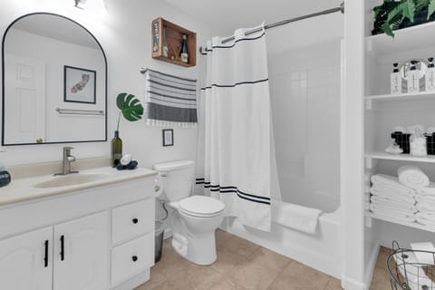 Full bathroom with antique touches. Fresh, bright white, and sparkling clean.