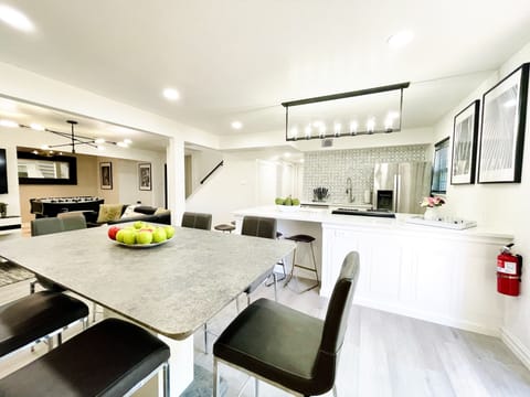 The stylish monochrome colors open concept dinning room.